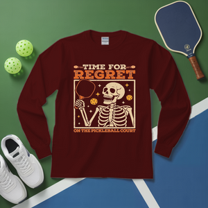 Maroon long-sleeve shirt with skeleton design and text on a pickleball court background