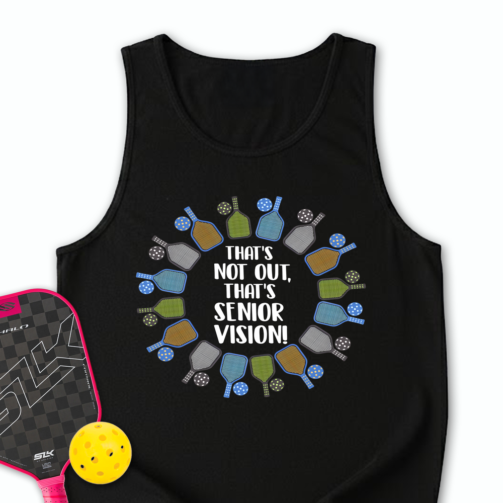 Black tank top with pickleball design and text, next to a pickleball paddle and ball on a white background