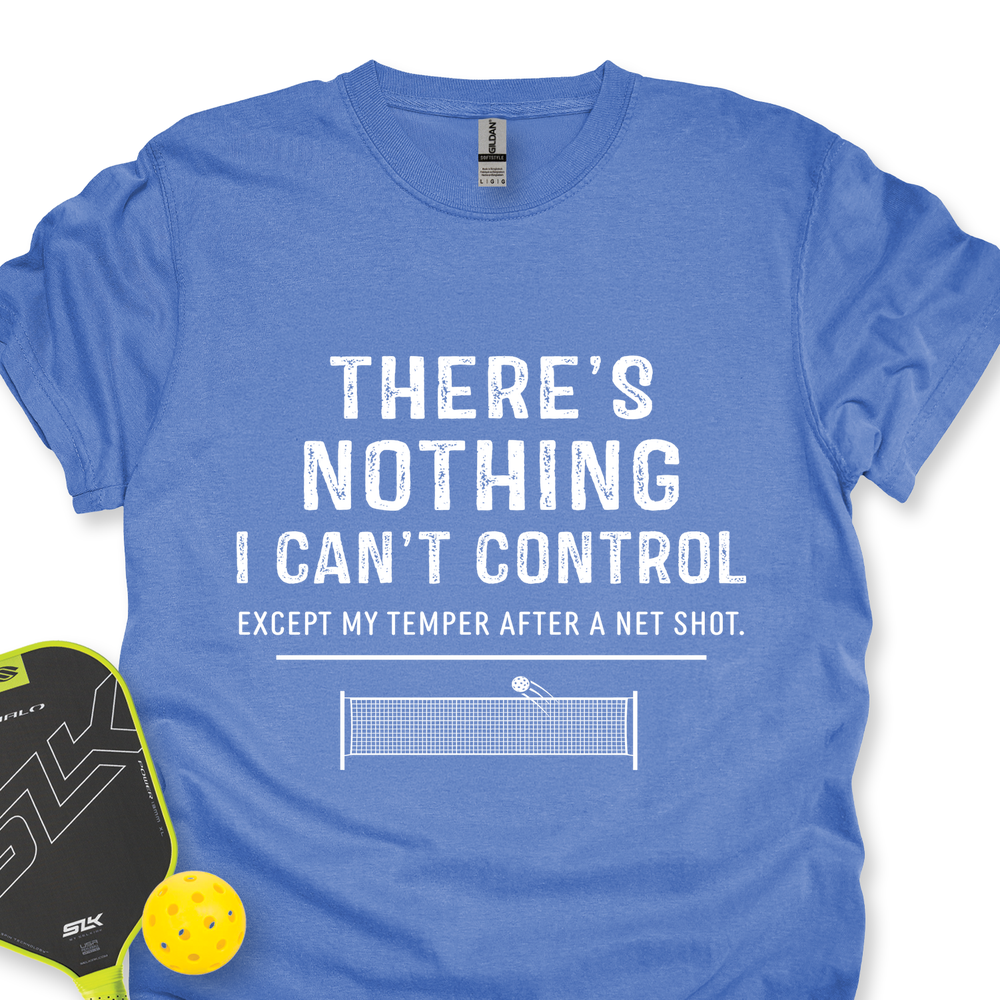 Blue t-shirt with humorous text and pickleball accessories on a white background