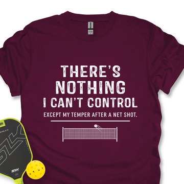 Maroon t-shirt with humorous text design, pickleball paddle, and ball on a white background