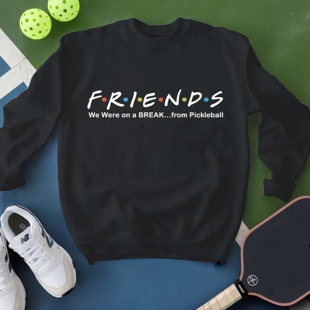 Black sweatshirt with 'FRIENDS' design and pickleball equipment on a green and blue background