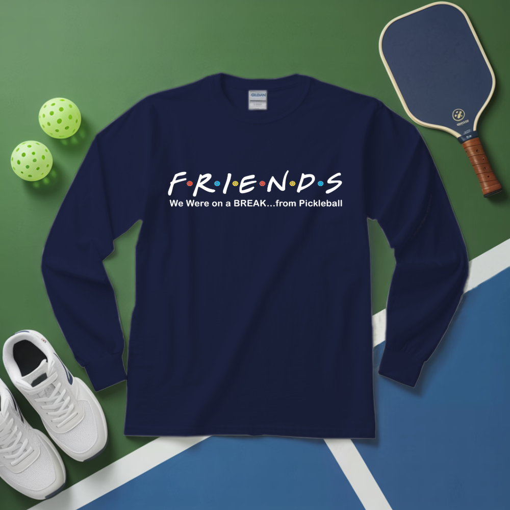 Navy blue sweatshirt with 'FRIENDS' design on a green and blue surface with pickleball equipment.