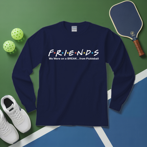 Navy blue sweatshirt with 'FRIENDS' design on a green and blue surface with pickleball equipment.