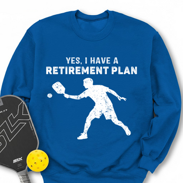 Blue sweatshirt with a white graphic and text 'YES, I HAVE A RETIREMENT PLAN' on a white background.