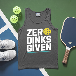 Gray tank top with 'ZERODINKS GIVEN' text, pickleball paddles, and balls on a green and blue surface.