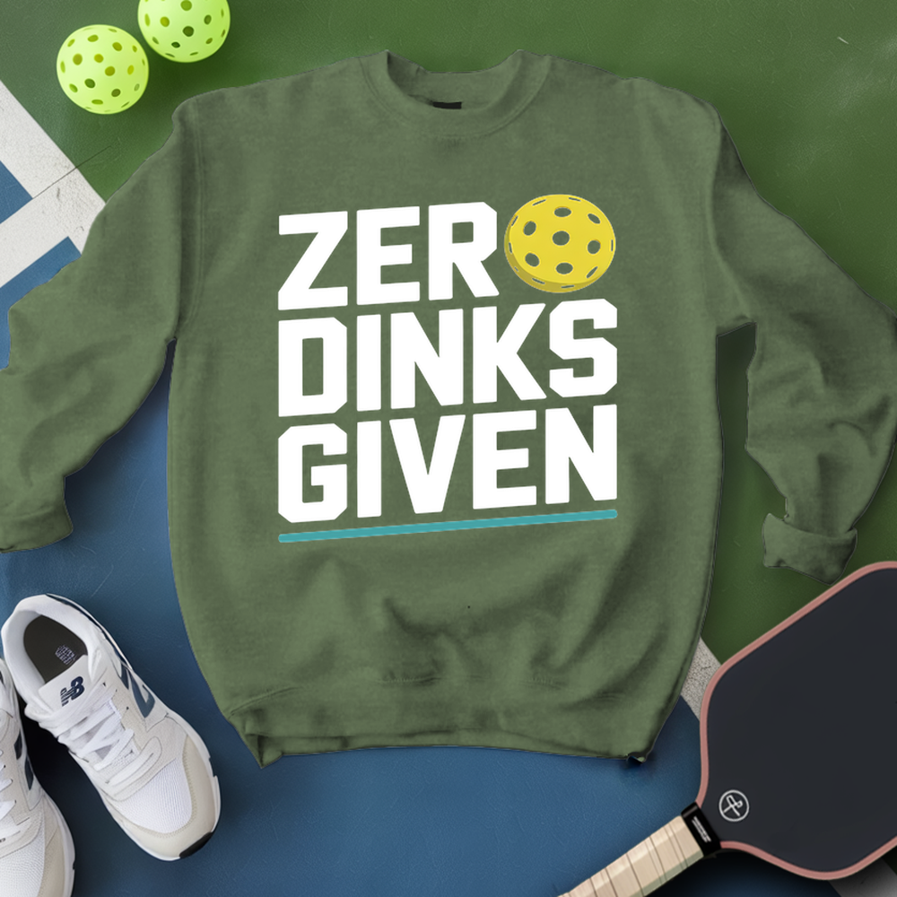 Green sweatshirt with 'ZER DINKS GIVEN' text, pickleball paddles, and balls on a green and blue background