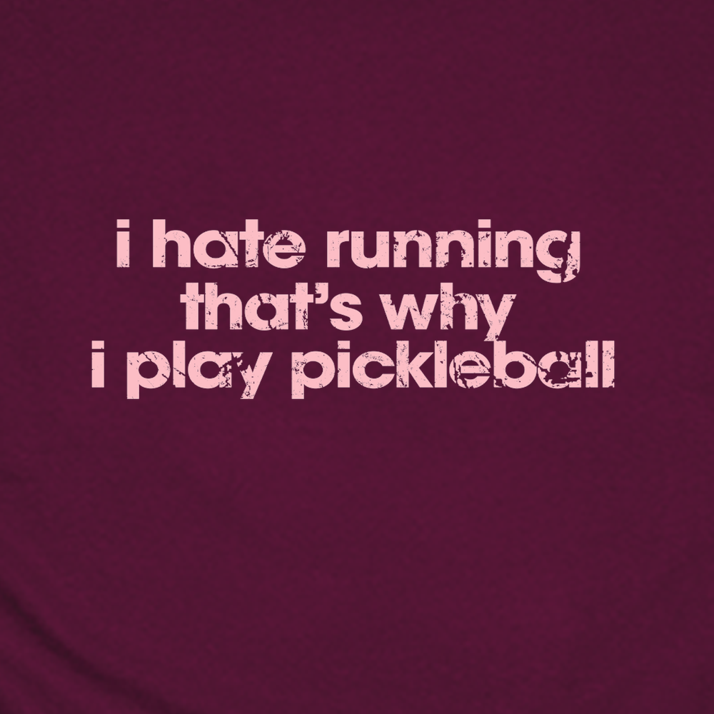 Maroon t-shirt with white text 'i hate running that's why i play pickleball' on a solid background
