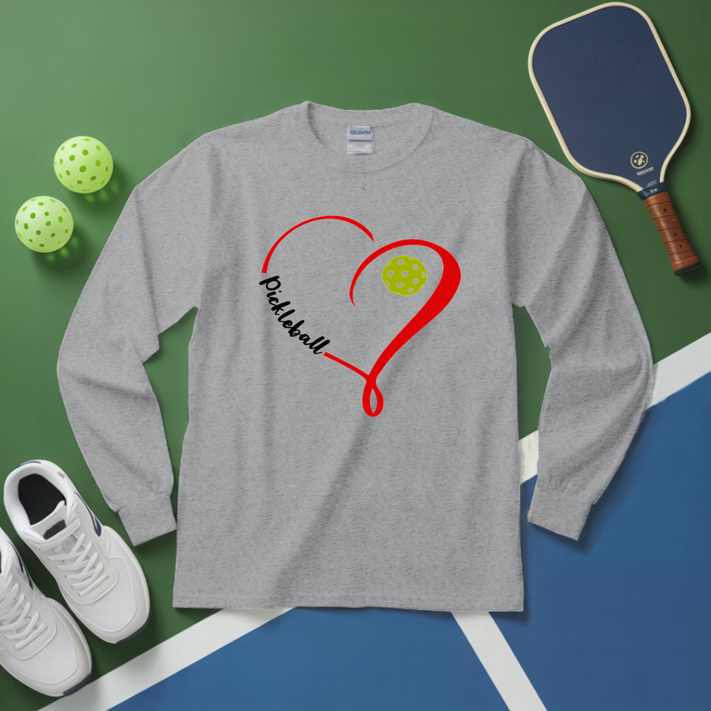 Gray long-sleeve shirt with pickleball design on a green and blue surface with pickleball equipment.