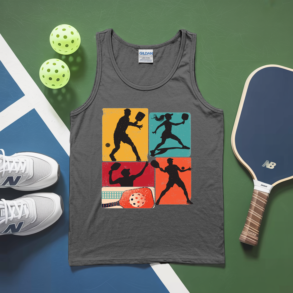 Gray tank top with pickleball design, pickleballs, paddle, and shoes on a green and blue surface