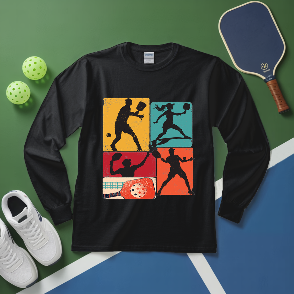 Black long-sleeve shirt with pickleball design on a green and blue surface with pickleball equipment.