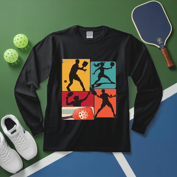 Black long-sleeve shirt with pickleball design on a green and blue surface with pickleball equipment.