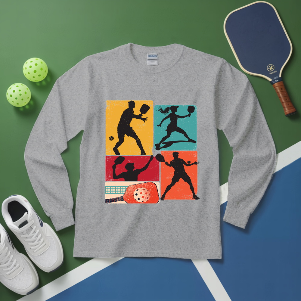 Gray long-sleeve shirt with pickleball design on a green and blue surface with pickleball equipment.