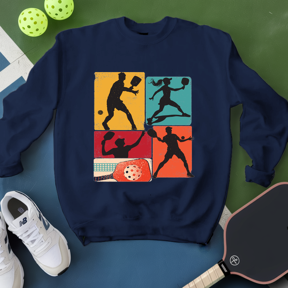 Navy blue sweatshirt with pickleball design on a green and blue background