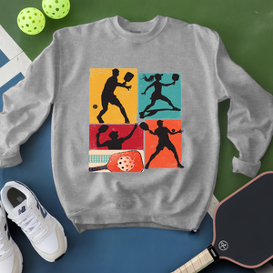 Gray sweatshirt with pickleball-themed design on a green and blue background