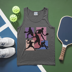 Gray tank top with pickleball design, white sneakers, pickleballs, and paddle on a green and blue surface.