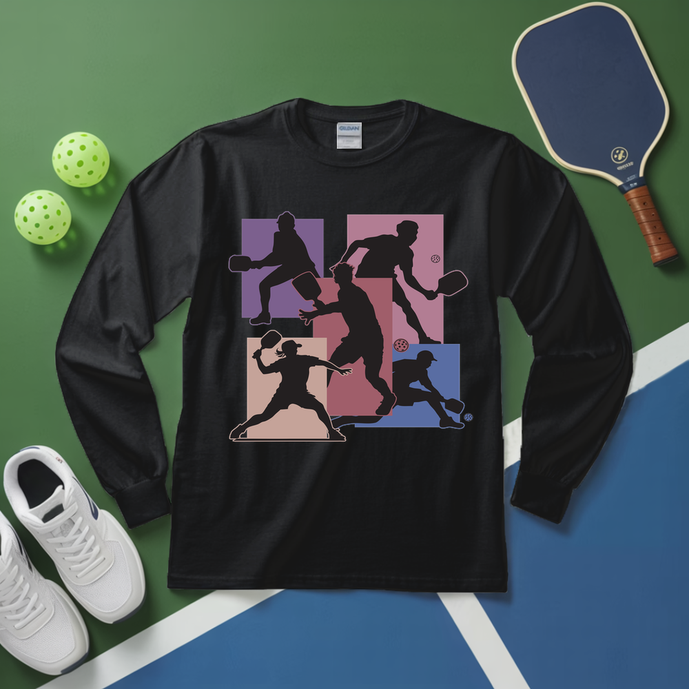 Black long-sleeve shirt with pickleball player design on a green and blue background with pickleball equipment.