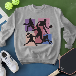 Gray sweatshirt with pickleball player design on a green and blue background